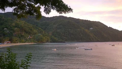 Time-lapse of sun setting on tropical beach Stock Footage 169594319