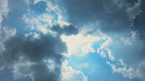 Time lapse of sun shining in blue sky with clouds movement Stock Footage 134557639