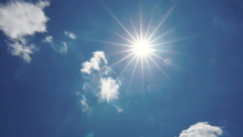 Time lapse of sun shining in blue sky with clouds movement Stock Footage 155215996