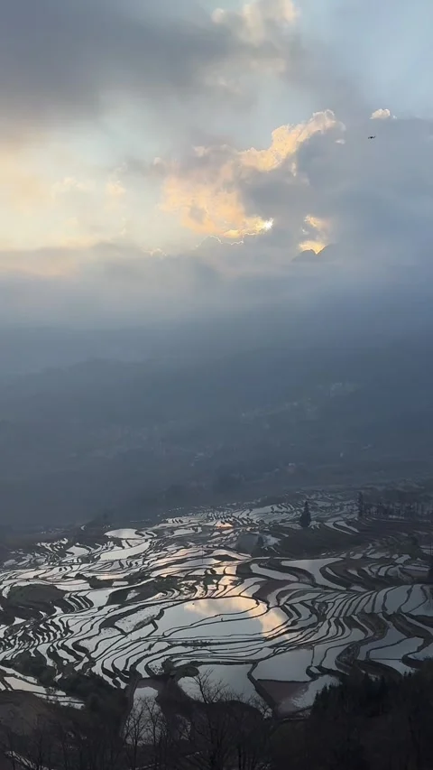Time-lapse of Sunbeams over Hani Rice Terraces Stock Footage 328893256