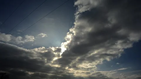 Time lapse of sunbeams shining through clouds Stock Footage 48223359