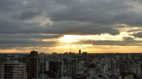 Time lapse of sunbeams through moving clouds at sunset over Buenos Aires city Stock Footage 134215219