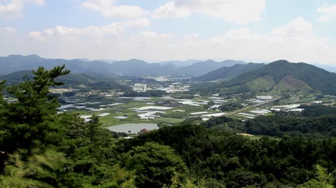 Time lapse of sunlight on mountain and village Stock Footage 27979986