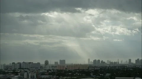 Time lapse sunlight ray on cityscape and storm cloudy blue sky Stock Footage 172186259