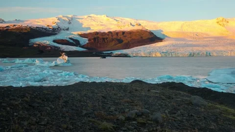 Time lapse of sunlight shining on a glacier in Iceland 動画素材 156405698