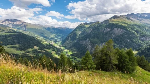 Time Lapse - Sunny day with a view to the mountain  in the alps Stock Footage 99361510