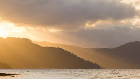 Time lapse of sunrays through the Scottish highlands Stock Footage 147617856
