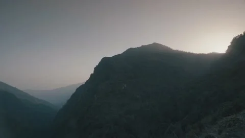 Time-lapse The Sunrise appear from behind mountain Stock Footage 154019861