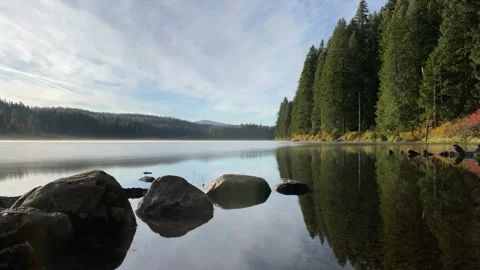 Time lapse of sunrise clouds at Clear Lake in Oregon Stock Footage 336572604