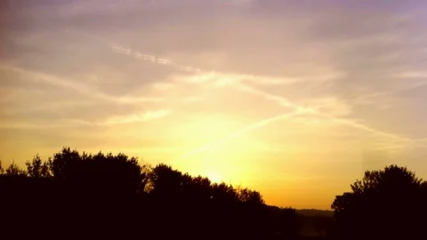 Time Lapse of Sunrise: Clouds Speed Toward the SunRising Stock Footage 70427171