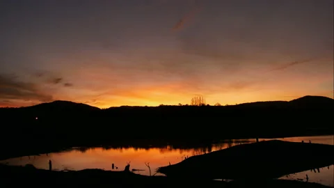 Time Lapse of Sunrise with Colorful dramatic sky over the lake Stock Footage 133938964