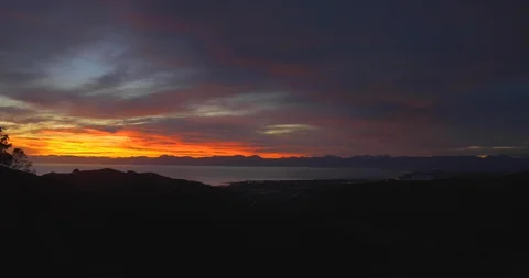Time-lapse sunrise with deep oranges and blues Stock Footage 98450126