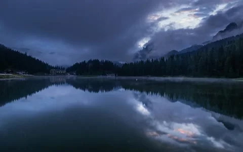 Time-lapse of a Sunrise in the Dolomites mountains with mist and fog at the lake Stock Footage 196127699