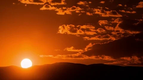 Time Lapse - Sunrise from Mountain Rage with Beautiful Clouds Stock Footage 69871691