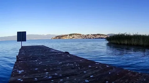 Time lapse of sunrise in Ohrid seen from wooden pier, Macedonia Stock Footage 80896413