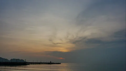 Time-lapse sunrise or sunset with floating fishing boats on the sea, clouds.. Stock Footage 244856356
