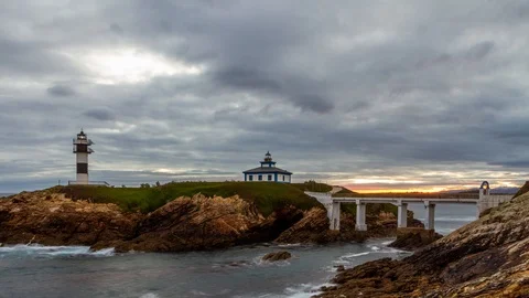 Time lapse of sunrise over the Pancha island and lighthouse, Ribadeo Stock Footage 118412767