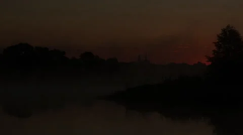 Time lapse of Sunrise over river, lanscape, fog running over the river, church Stock Footage 68148251