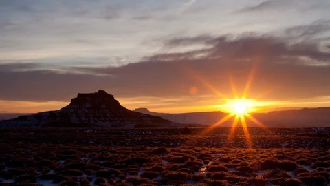 Time lapse of the sunrise over snow covered desert in Valley of the Gods Stock Footage