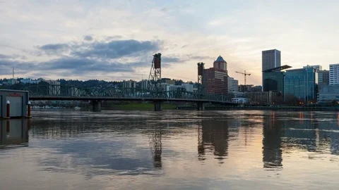 Time lapse of sunset and clouds over Portland Or with water reflection 4k uhd Stock Footage 73672144