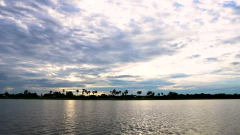 Time-lapse sunset  and clouds on river in evening time. Stock Footage 138092899