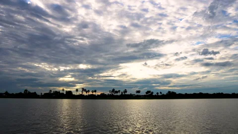 Time-lapse sunset  and clouds on river in evening time. Stock Footage 138093786