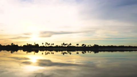 Time-lapse sunset  and clouds on river in evening time. Stock Footage 138093787