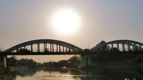 Time Lapse of Sunset and dramatic sky behind the bridge. Stock Footage 104245390