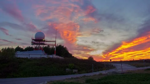 Time lapse sunset and driving cars on the road, Industrial Antenna radar Stock Footage 81331401