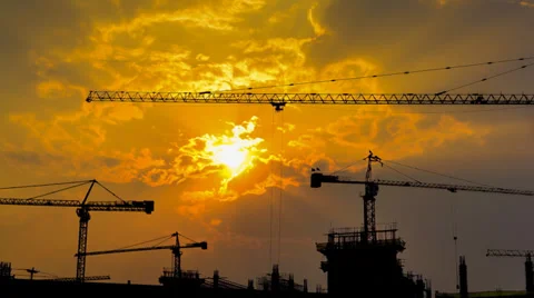 Time lapse sunset and silhouette crane working in construction site (zoom out) Stock Footage 39772432