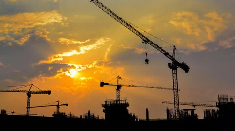 Time lapse sunset and silhouette crane working in construction site (zoom in) Stock Footage 39778713