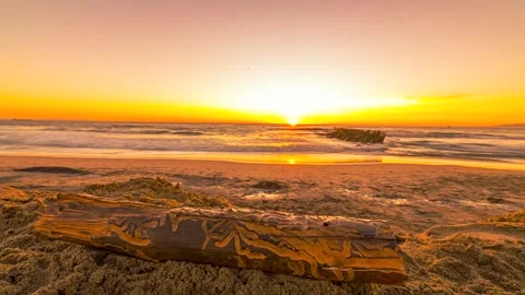 Time-Lapse Sunset at the Beach with People Walking on Sand (Out of Focus) Stock Footage 301336544