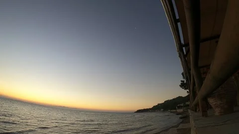 Time lapse of a sunset at the beach under the bridge, under the pier. Stock Footage 202023242