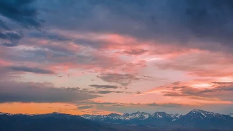 Time Lapse - Sunset with Beautiful Cloudscape and Snow-capped Mountain - 4K Stock Footage 77563443