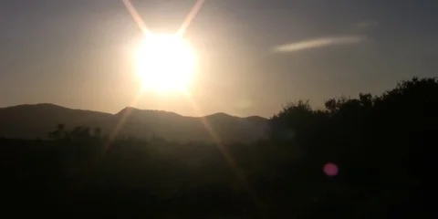 Time Lapse of the sunset behind a field Stock Footage 99118292