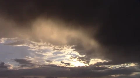 Time-lapse sunset behind rain clouds Stock Footage 218633648