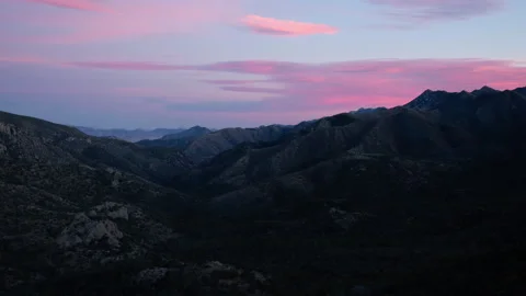 Time lapse of Sunset clouds above a Chiricahua national monument mountain valley Stock Footage 228991051