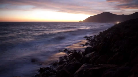 Time lapse of sunset clouds and Pacific Ocean waves at Point Mugu California Stock Footage 57200847