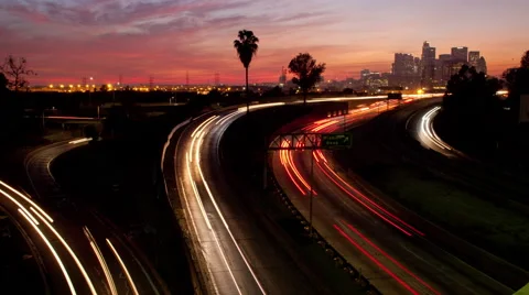 Time lapse of sunset clouds and freeway traffic in Los Angeles California Stock Footage 58118696