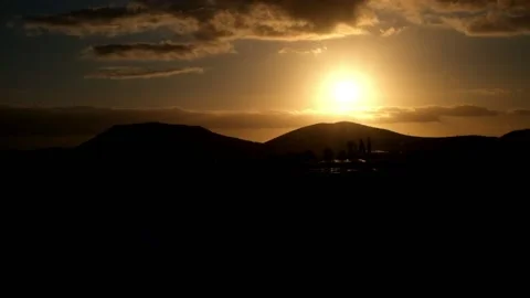 Time lapse of sunset with clouds and orange sky Stock Footage 141652607