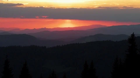 Time Lapse of Sunset Clouds Motion Over Hills, Mountains Silhouette. Stock Footage 76619427