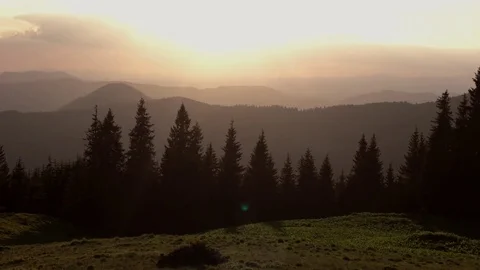 Time Lapse of Sunset Clouds Motion Over Hills, Mountains Silhouette. Stock Footage 76834167