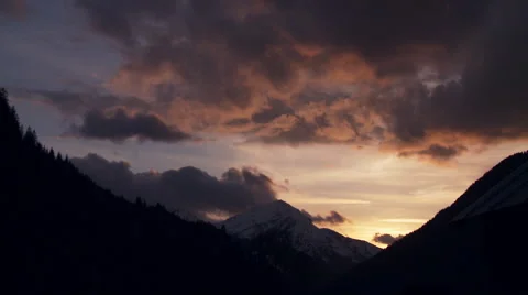 Time-lapse sunset with clouds in the mountains Stock Footage 58649319