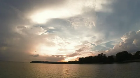 Time Lapse Sunset with Clouds over reflective ocean Stock Footage 56476532