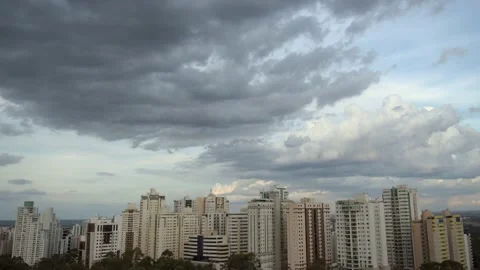 Time Lapse  - Sunset with clouds over the buildings of the city Stock Footage 135423961