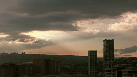 Time Lapse Sunset on the cloudy sky over the city Stock Footage 76180426