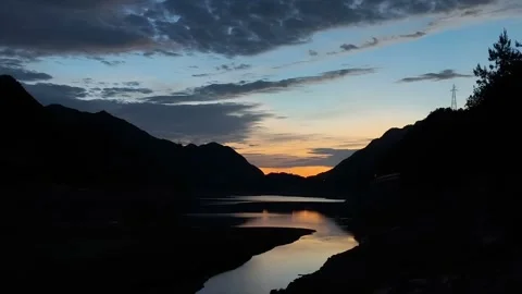 Time Lapse of Sunset Colors Reflected in Tibetan Plateau Lake China Stock Footage 338314175