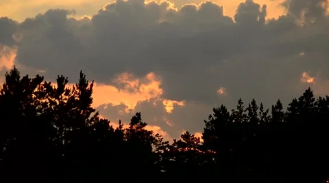 Time lapse of sunset with cumulus clouds moving in sky Stock Footage 52485492