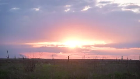 Time lapse of sunset with evening glow in the field Stock Footage 238090997