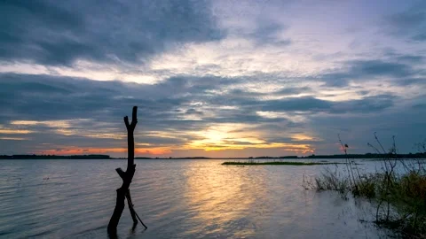 Time lapse sunset on hydroelectric lake on last day of autumn in peaceful Stock Footage 166023219